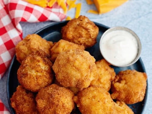 A plate of mac and cheese balls