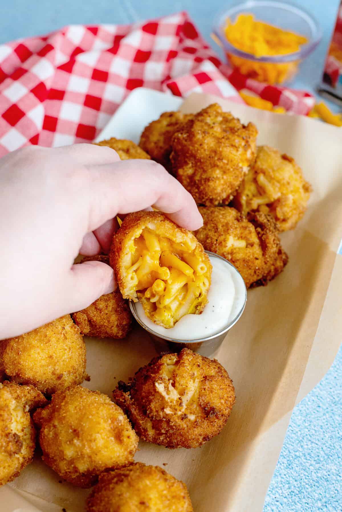 A serving of mac and cheese balls with a side of ranch