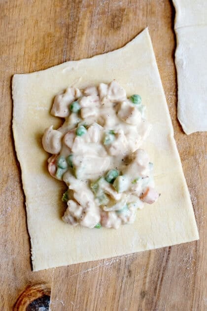 A puff pastry square with chicken pot pie filling