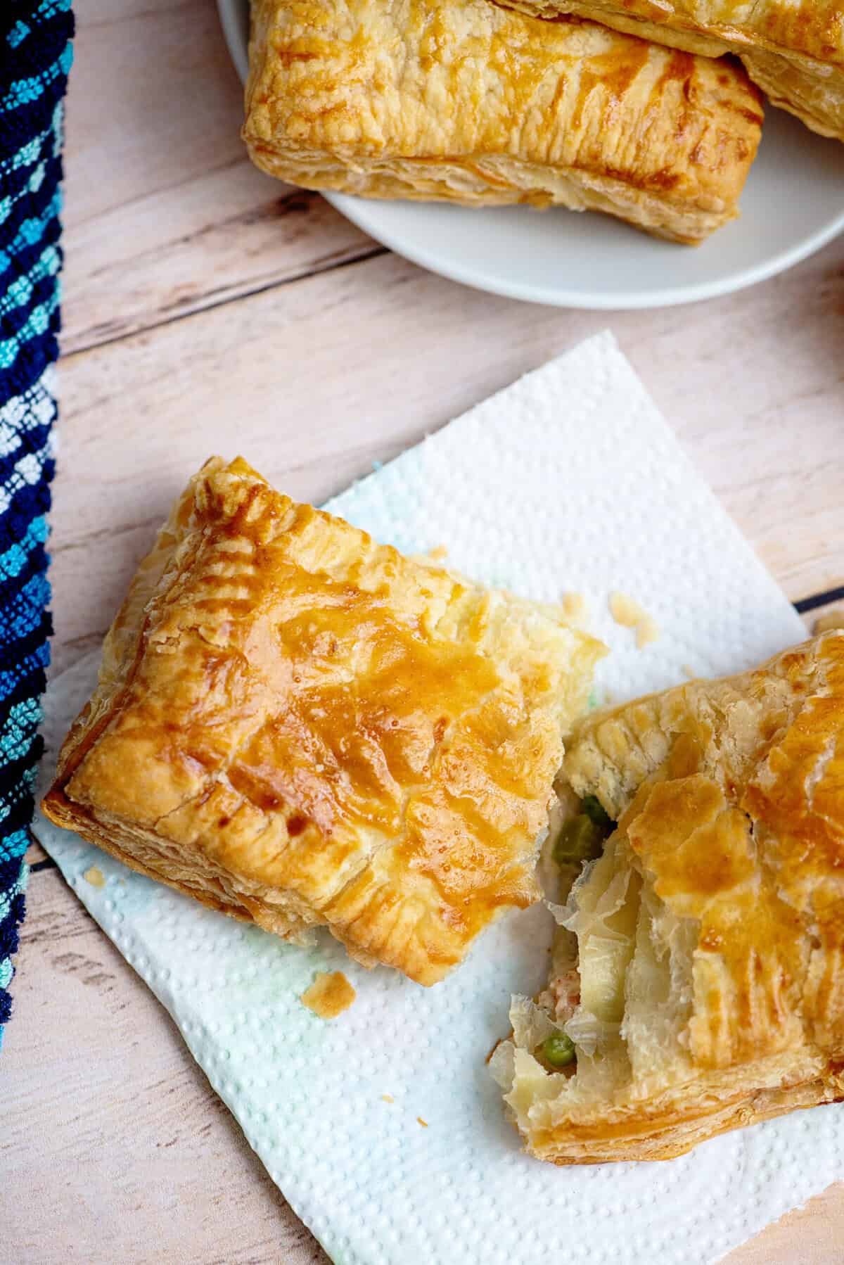 Handheld chicken pot pies on a napkin