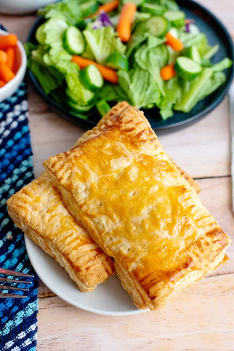 A plate of two handheld chicken pot pies