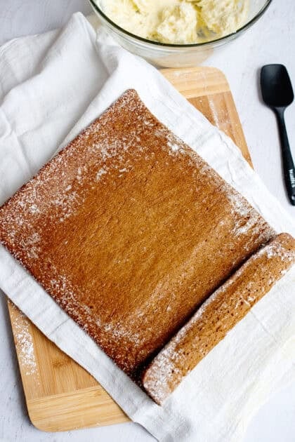 Unrolled pumpkin roll on a towel