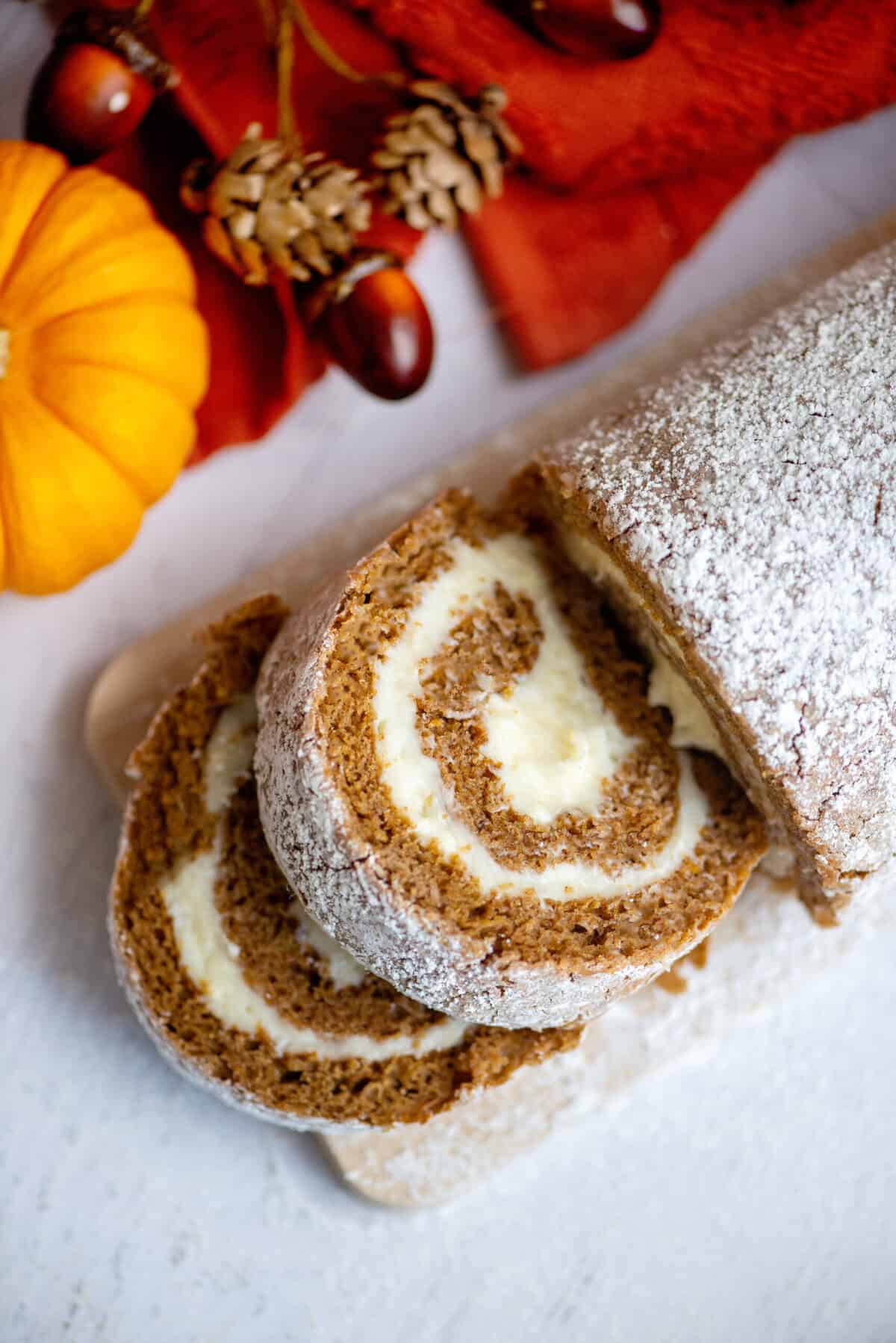 Pumpkin spice roll with slices falling from the roll.