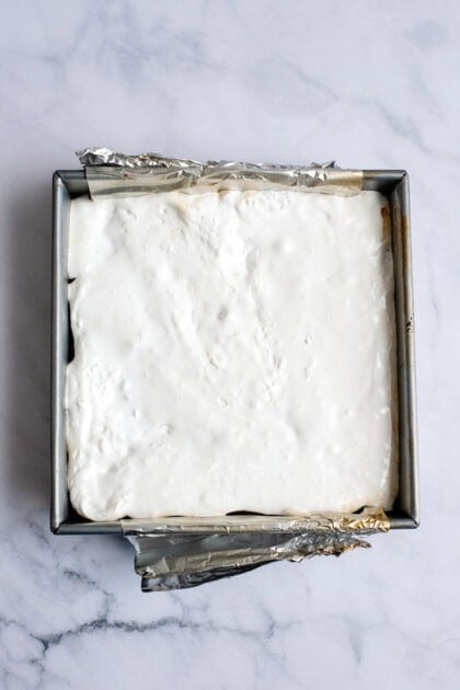 An even layer of marshmallow on the s'mores brownies