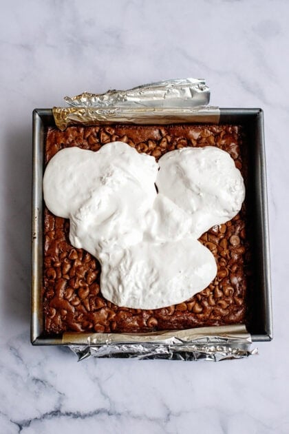 A layer of marshmallow paste on the s'more brownie mix