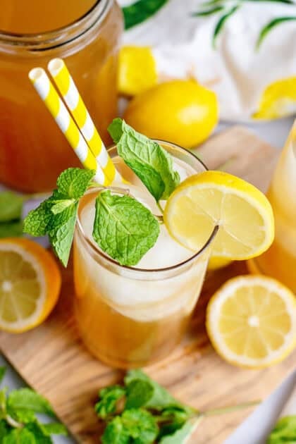A glass of Arnold Palmer with mint and lemon slice garnish