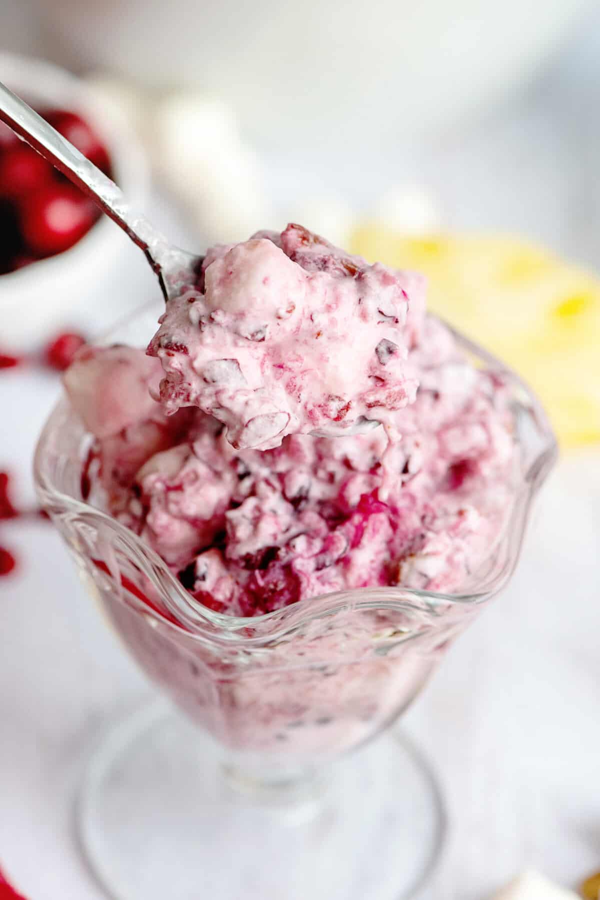 A small glass of cranberry fluff salad