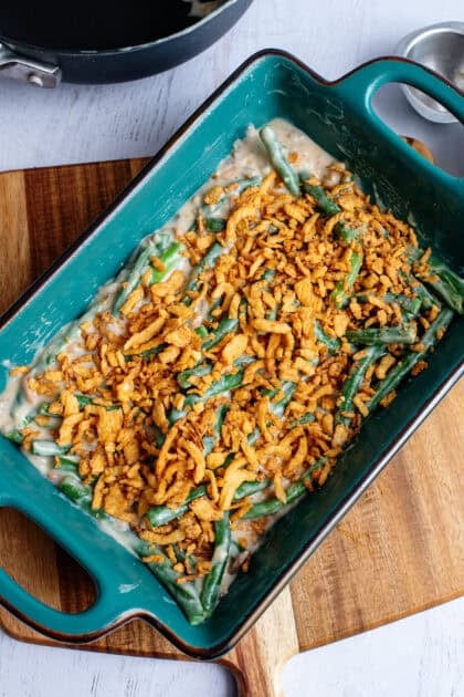 A baking dish with green bean casserole