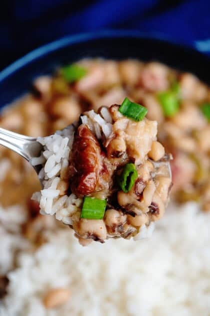Close up shot of a spoonful of served Hoppin' John