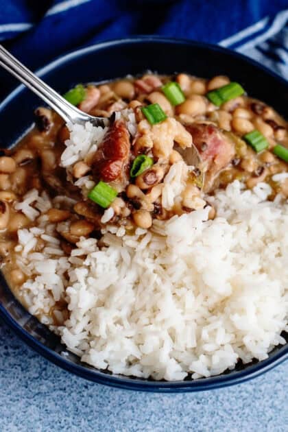 A bowl of served Hoppin' John with white rice