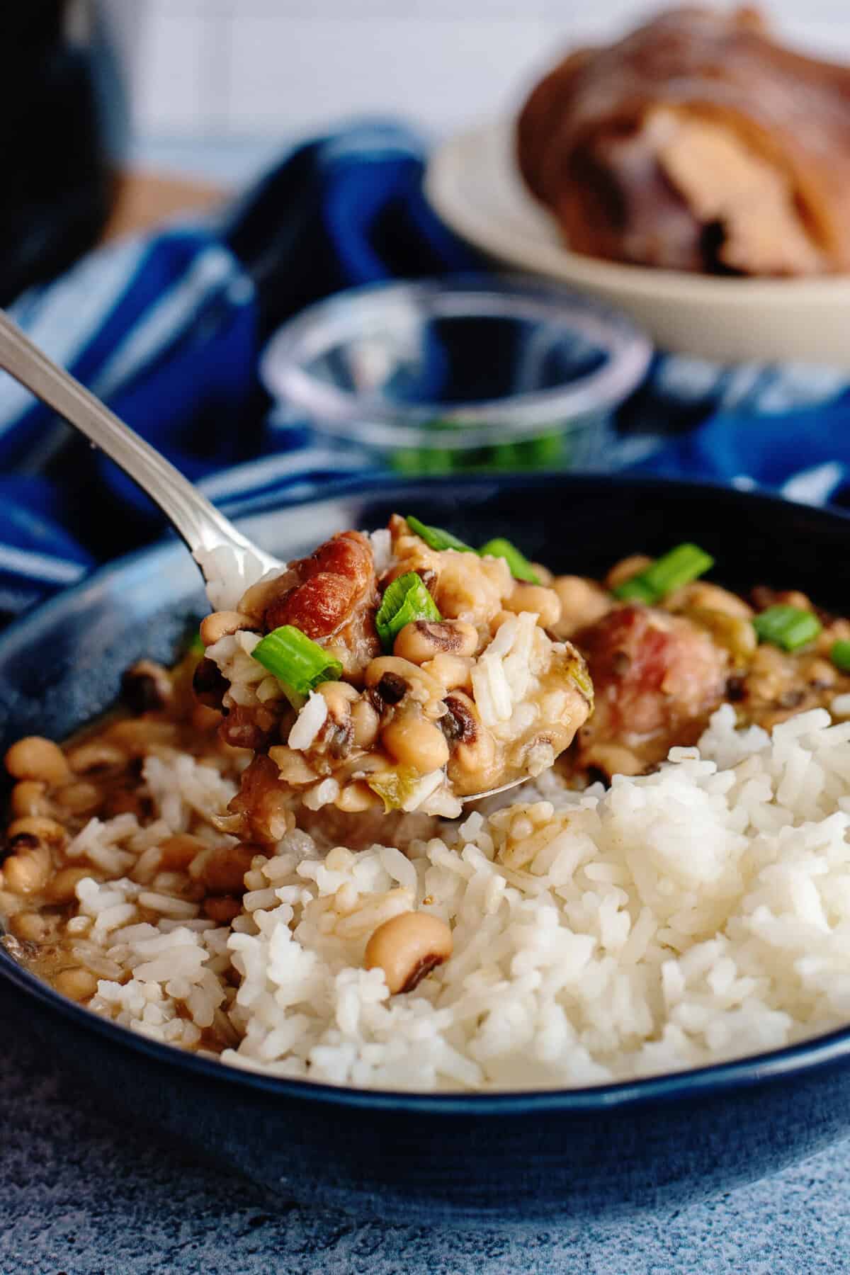 Taking a spoonful of  slow cooker Hoppin' John 