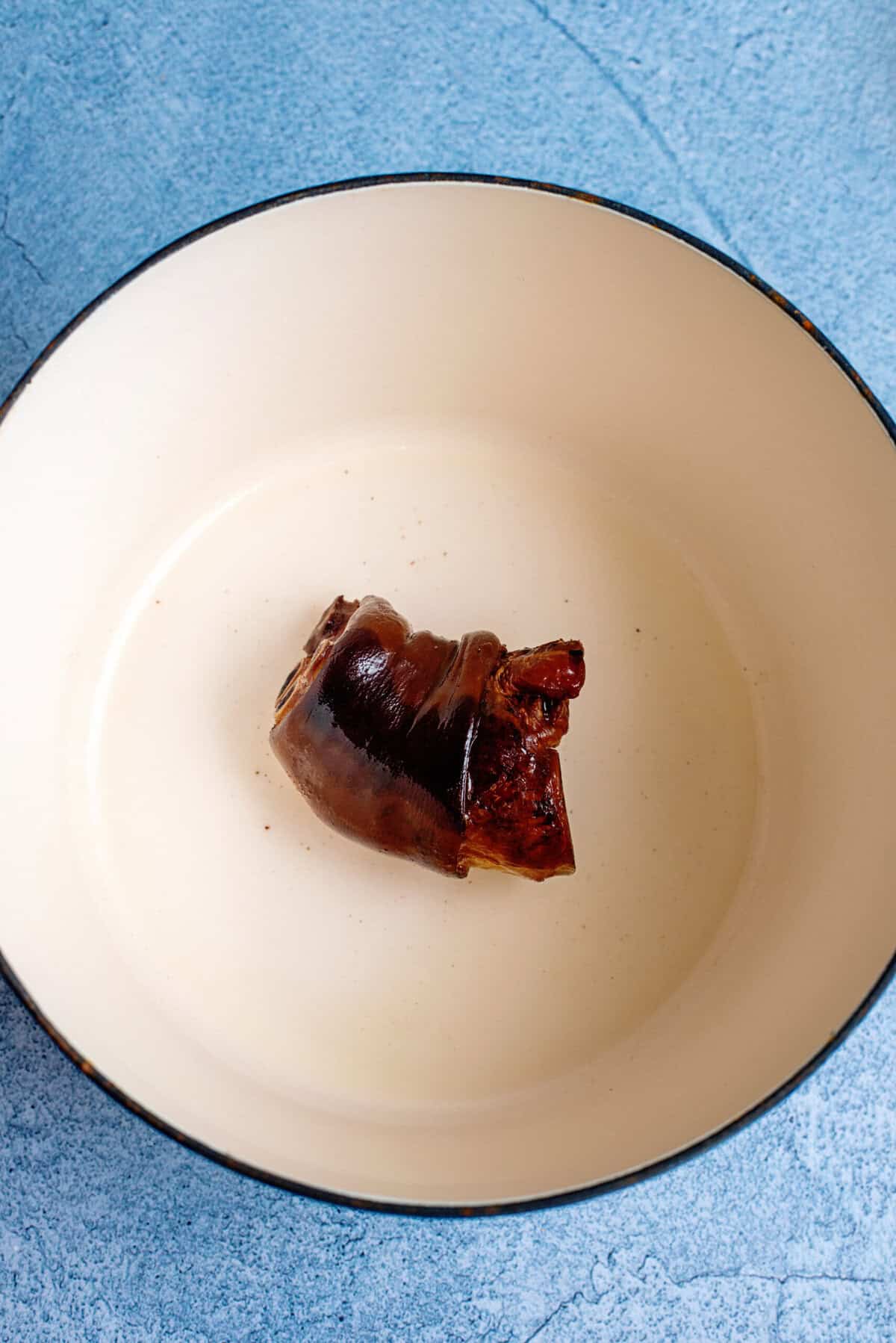 Searing ham hock in a skillet
