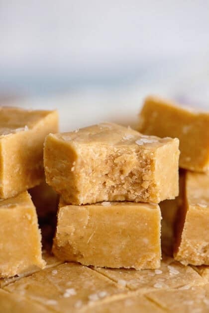 Peanut butter fudge with one piece having a bite taken out