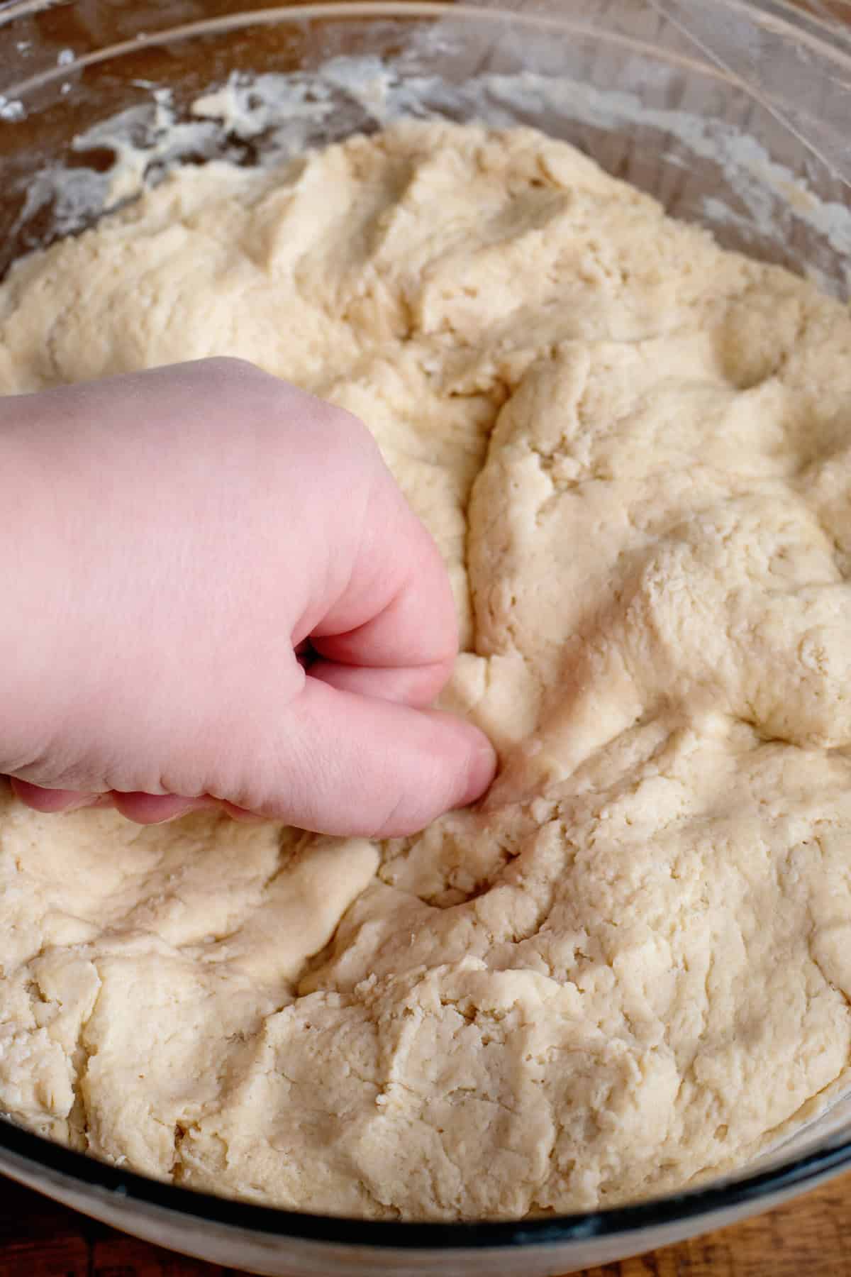 Punching the homemade dinner rolls dough