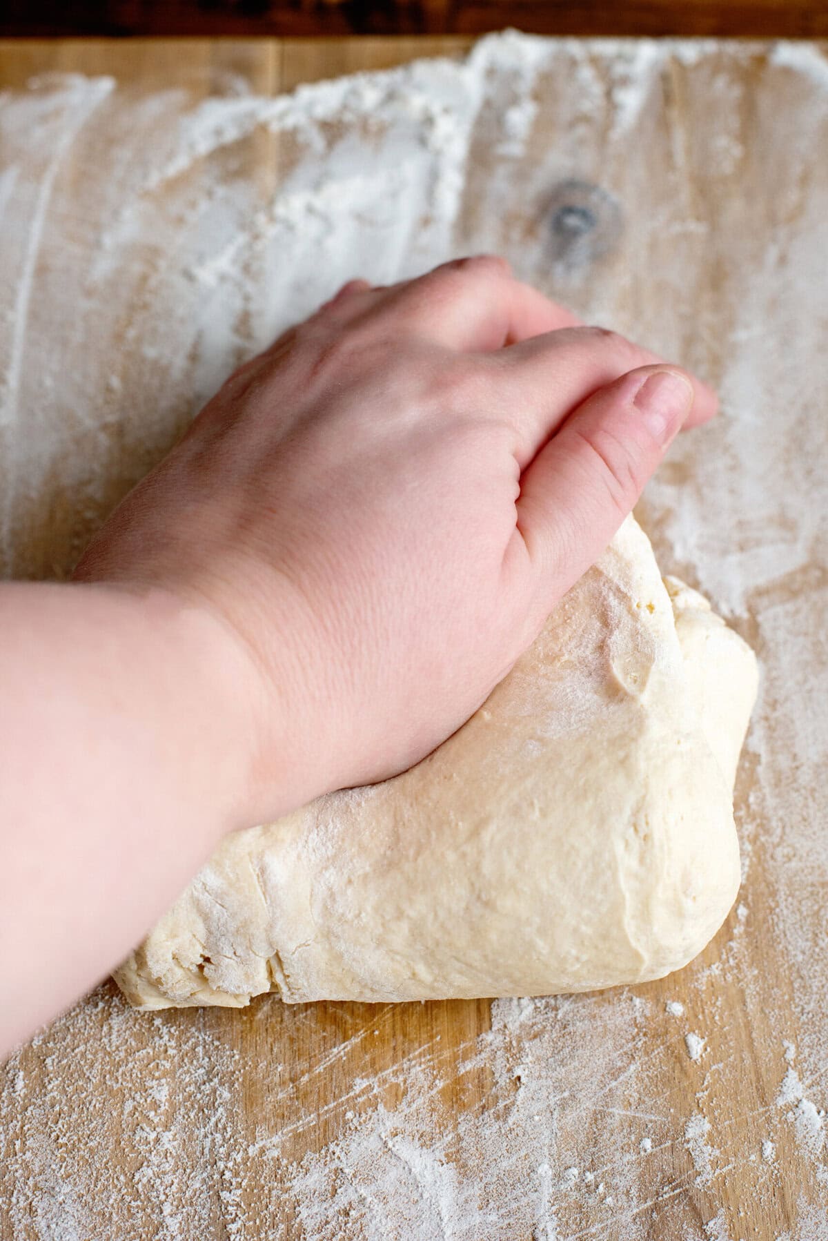 Kneading the dough for the homemade dinner rolls
