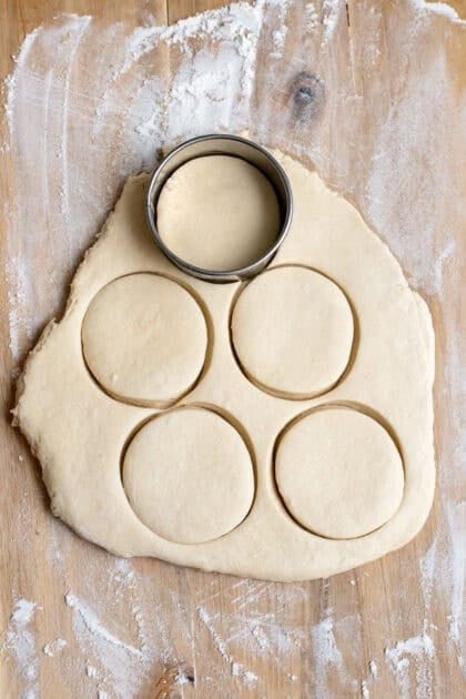 Cutting out the homemade dinner rolls from dough