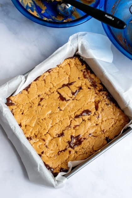 Peanut butter mixture spread evenly over the chocolate mixture