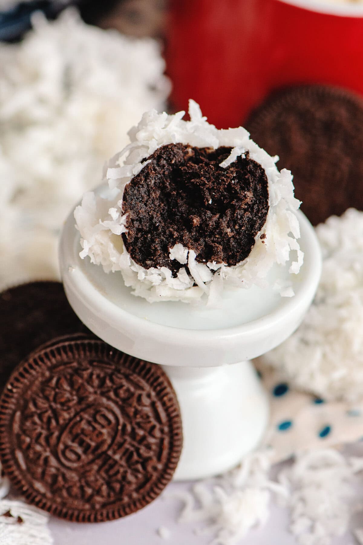 A half-eaten coconut-coated Oreo ball