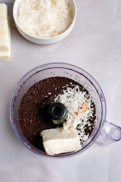 Butter and coconut in a food processor with crushed Oreos