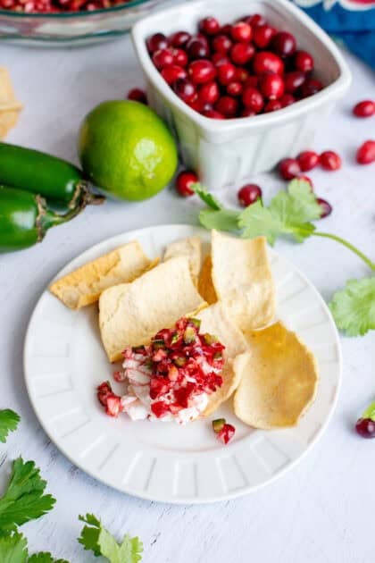 Cranberry Jalapeño Cream Cheese Dip on a chip