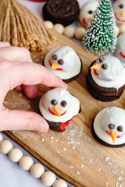 Snowman Oreo cookie balls on a serving tray