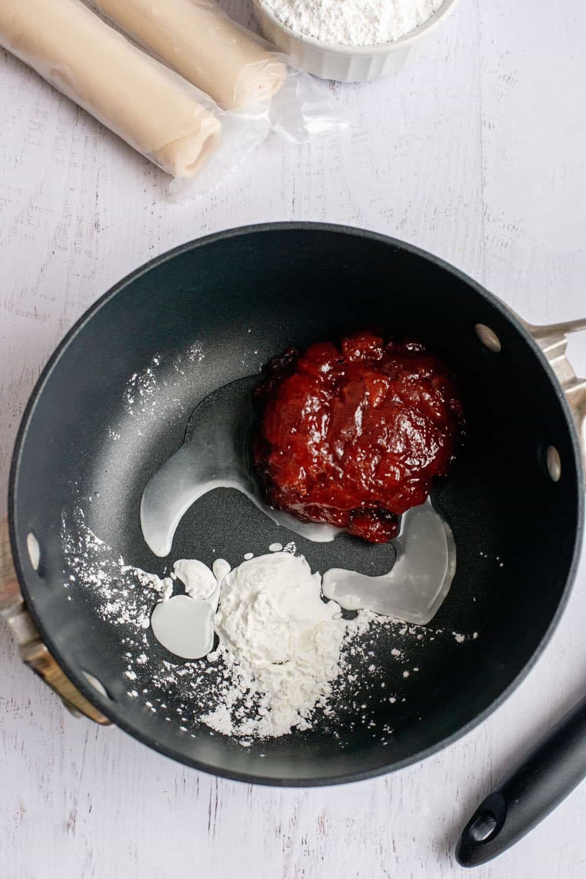 Strawberry jam, cornstarch, and water in a sauce pan