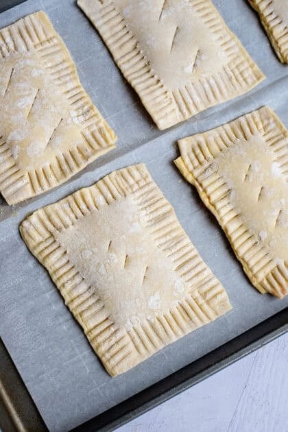 Scored homemade toaster strudels ready to bake