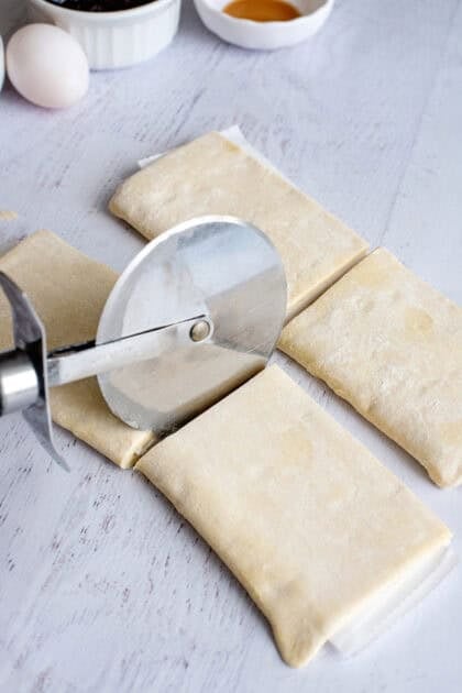 Cutting the pastry with a pizza cutter