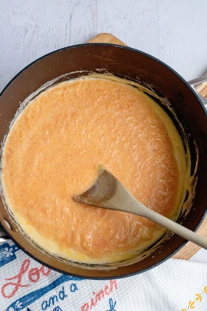 Blended veggie and cheese sauce in a pan