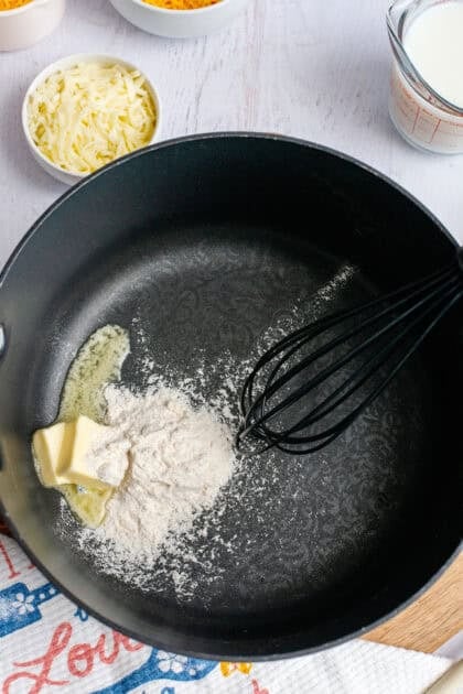 Melting butter in a pan and mixing it with flour