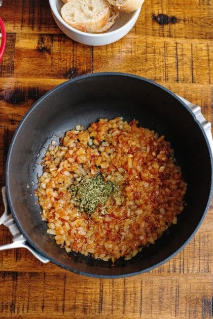 A sauce pan with caramelized onions