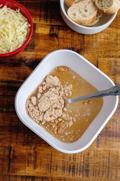 Mixing the French Onion soup mix in a bowl