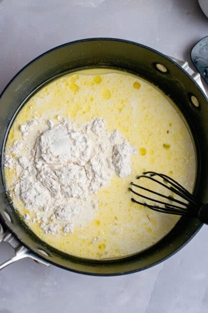 Adding flour to the chicken stock mixture