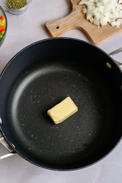 A skillet with a serving of butter