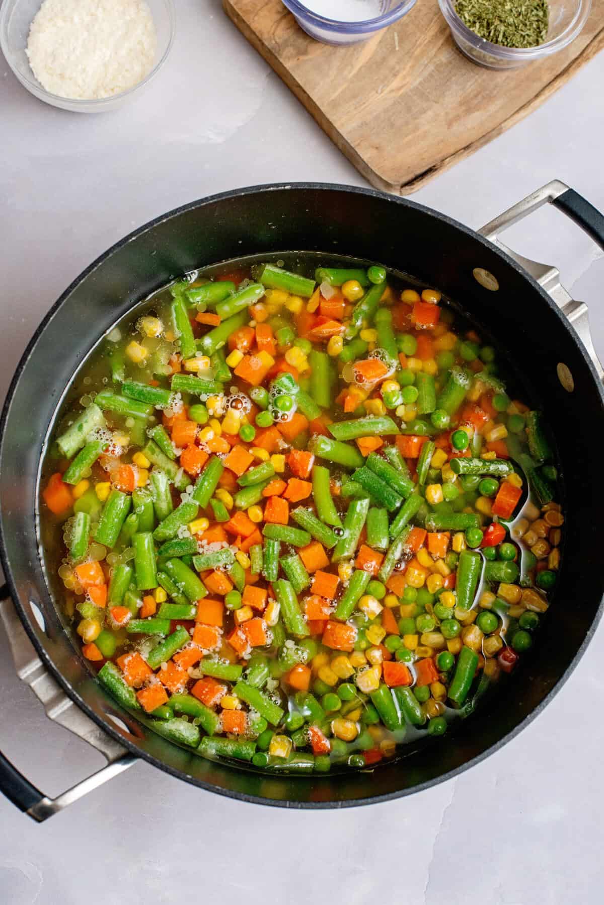 Skillet with vegetables and broth for low carb vegetable soup