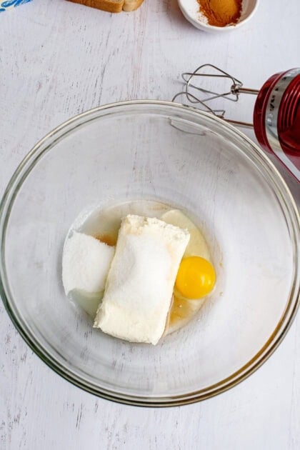 Cream cheese, egg, and vanilla in a mixing bowl