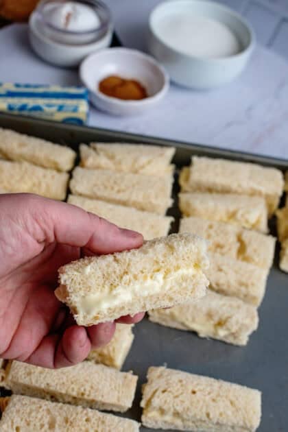 Holding a sliced stuffed cream cheese stick