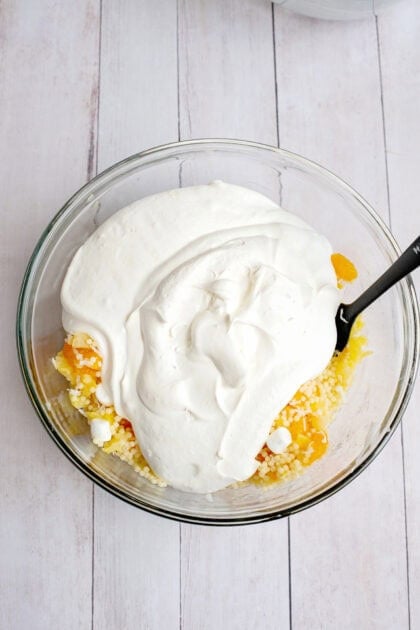 Adding custard to other Frog Eye Salad ingredients