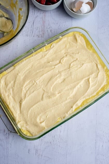 Smooth ricotta layer on raw lemon cherry cheesecake