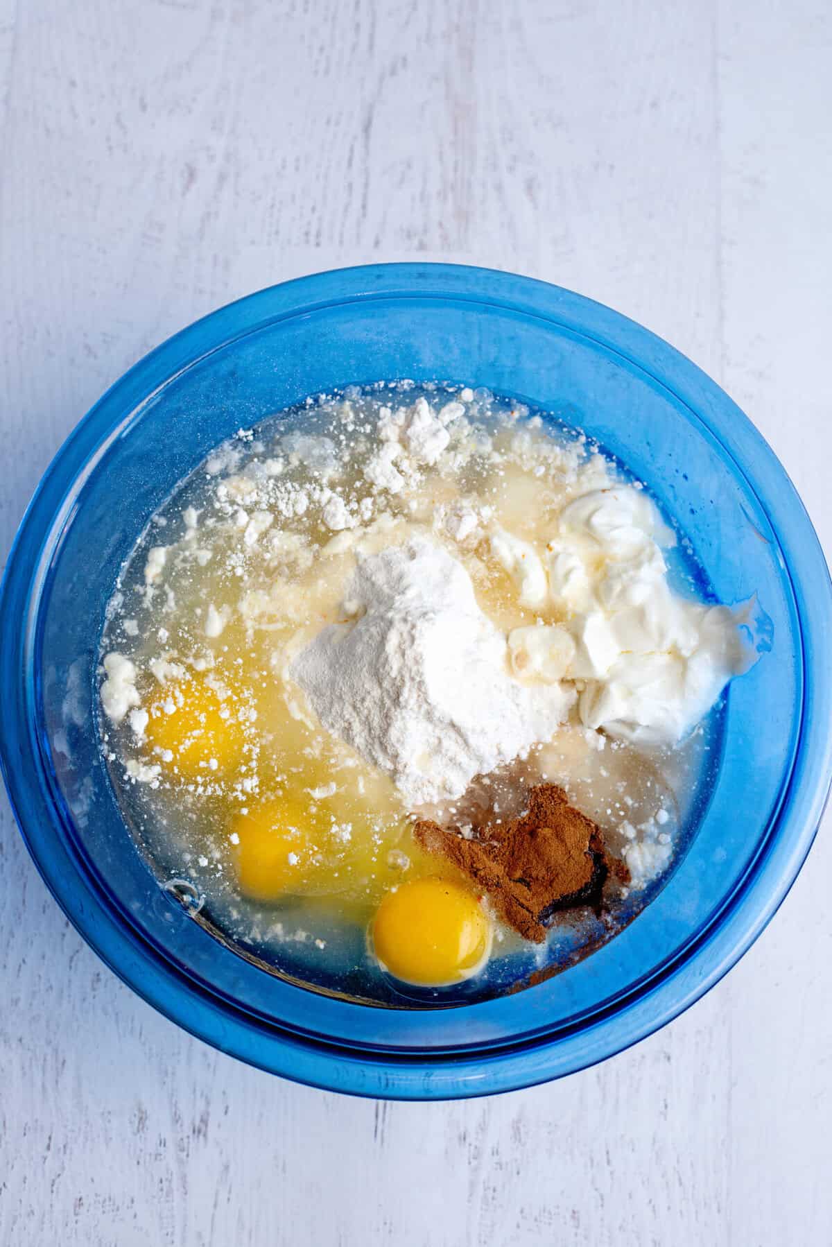 cake mix, eggs, oil, sour cream, vanilla, spices, and pear juice in a mixing bowl