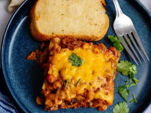 A serving of Tex Mex lasagna with some Texas toast