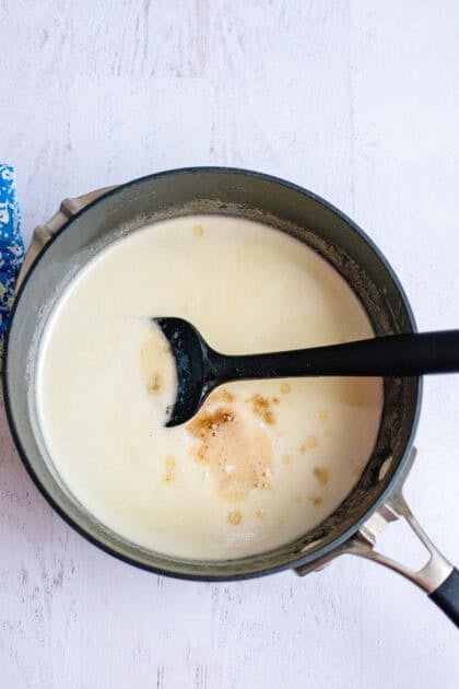 Stirring the vanilla in the pot of homemade buttermilk syrup