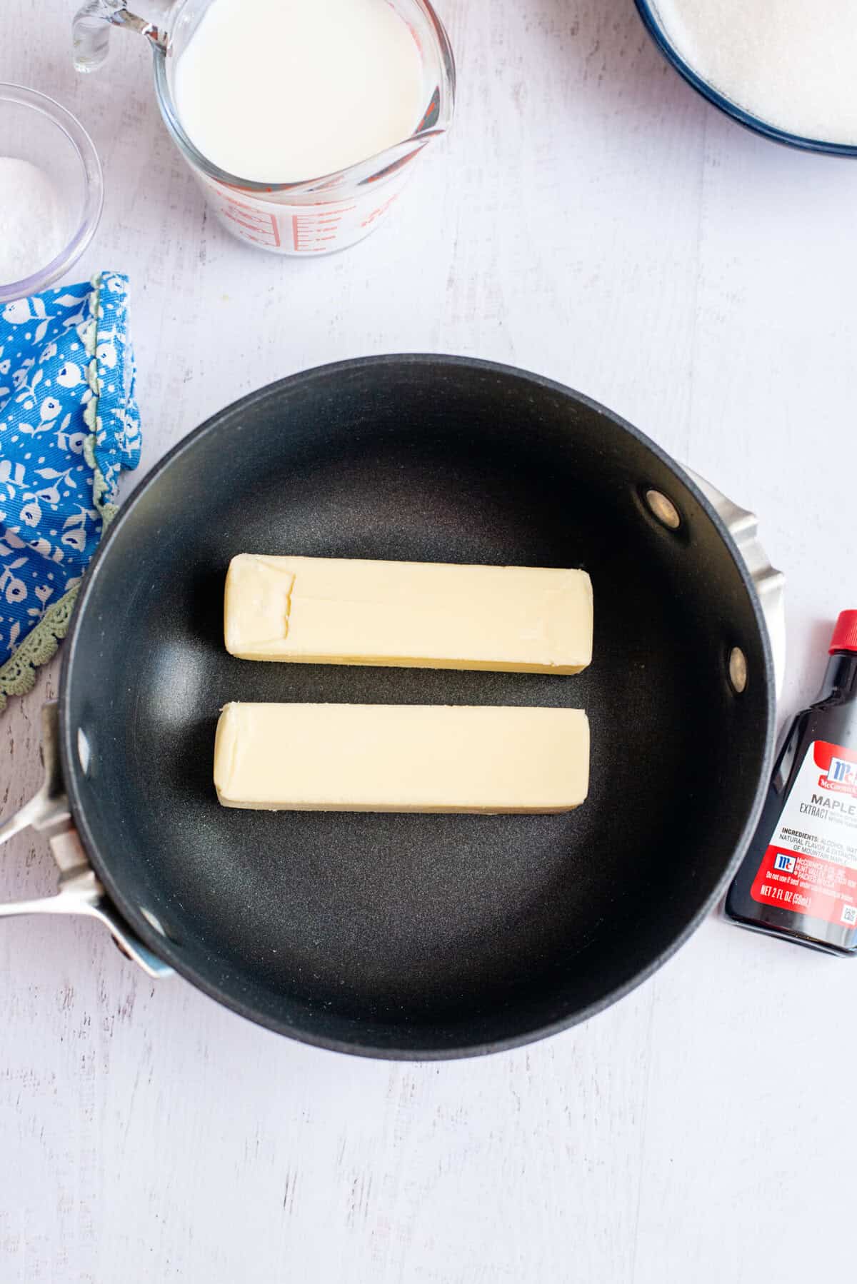 A pot with 2 sticks of butter