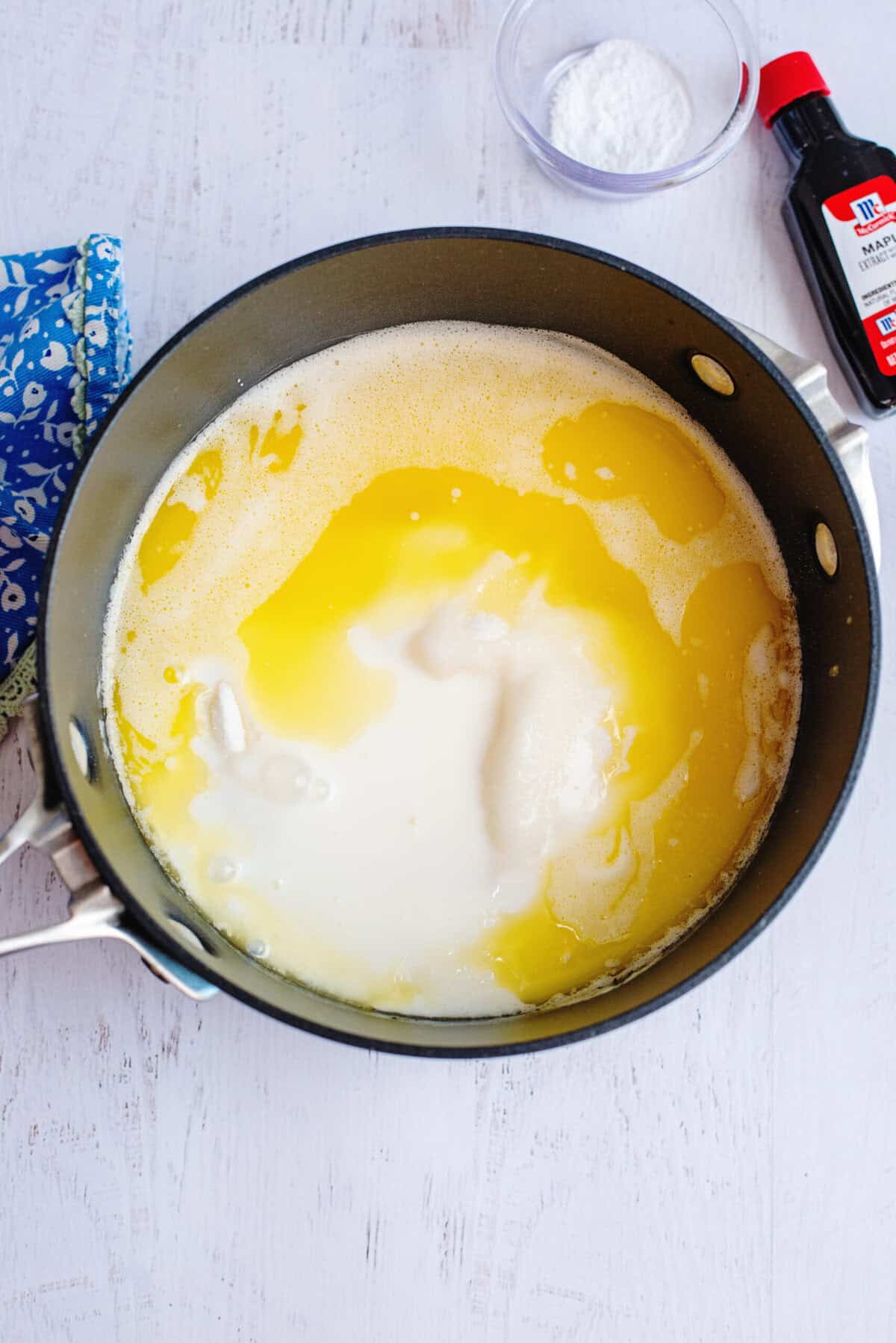 Stirring the sugar, buttermilk, and butter in a pot