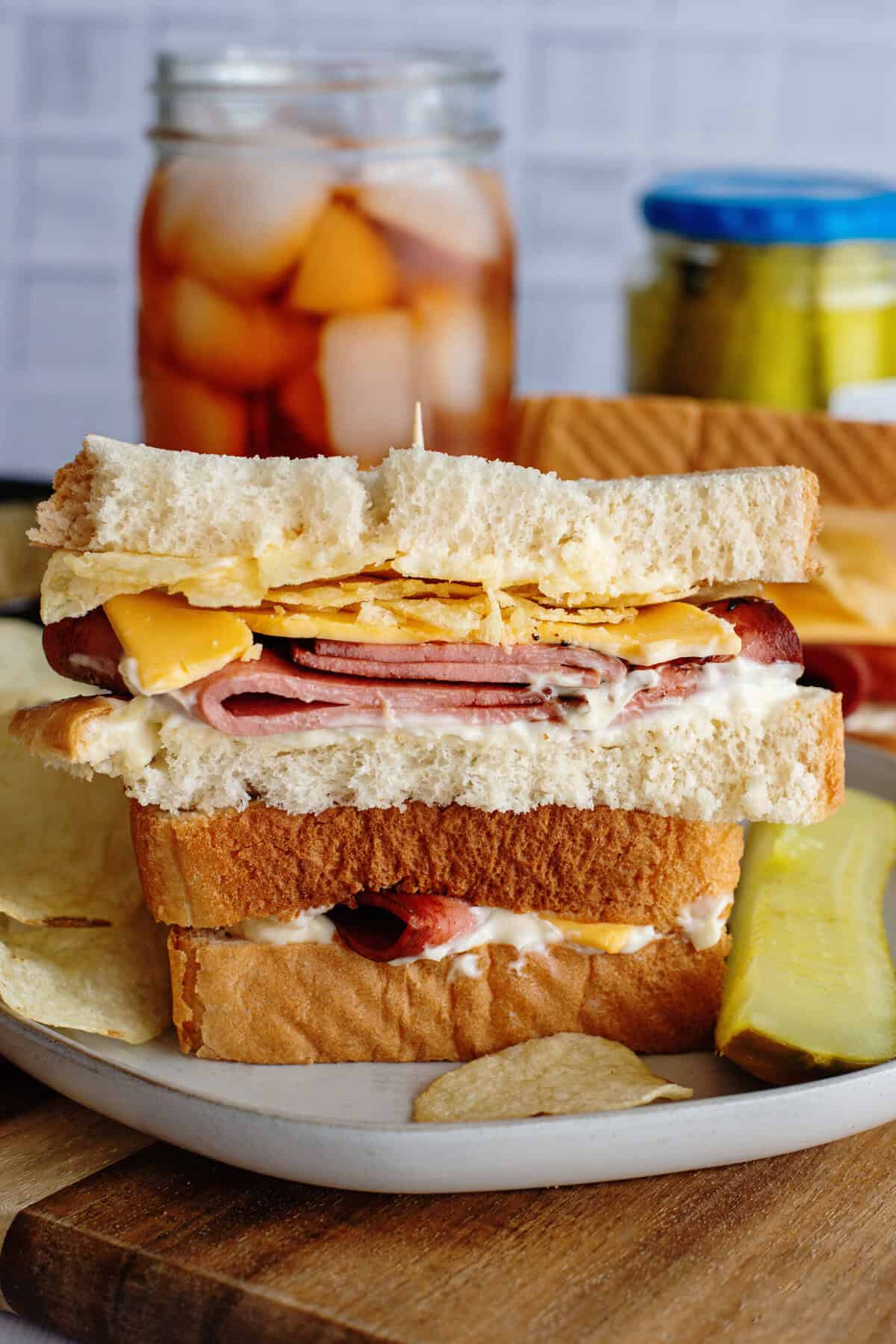 A sliced and stacked fried bologna sandwich