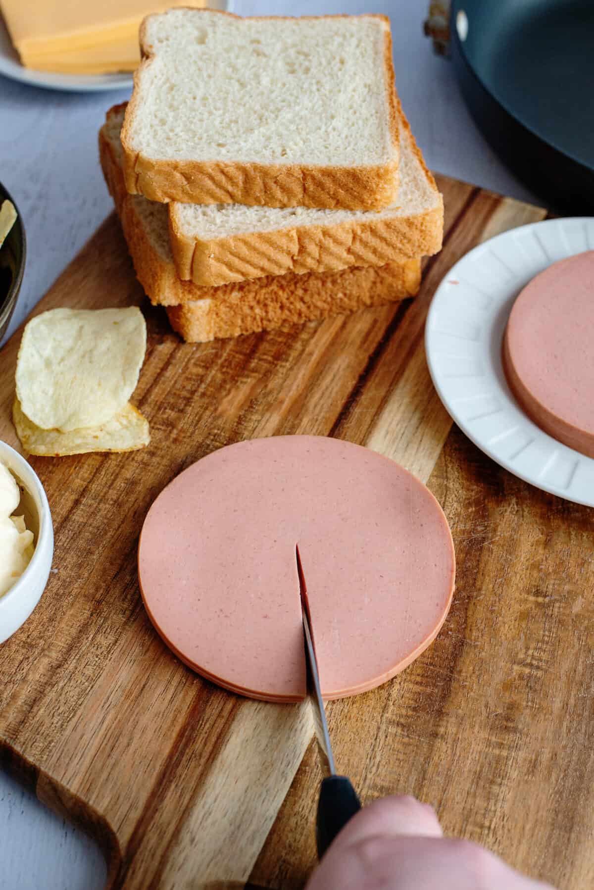 Cutting bologna slices down the middle