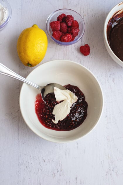 A bowl of cream cheese and raspberry reserves