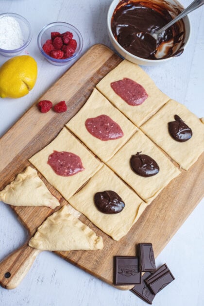 Adding fillings to the cut squares of crescent dough