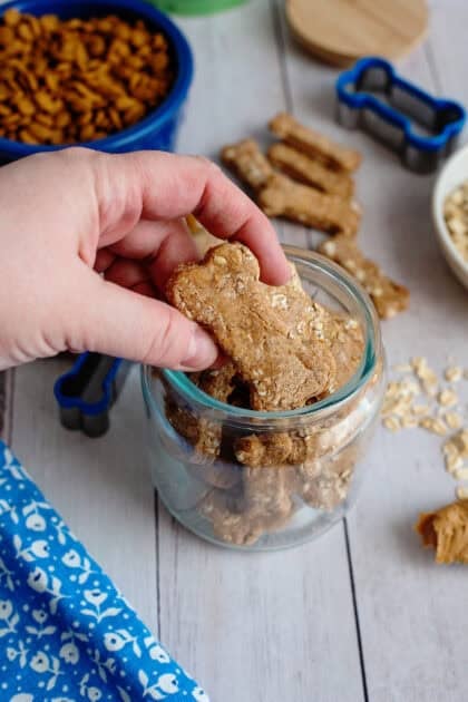 Placing the Bill Gent's Doggie Biscuits in a mason jar