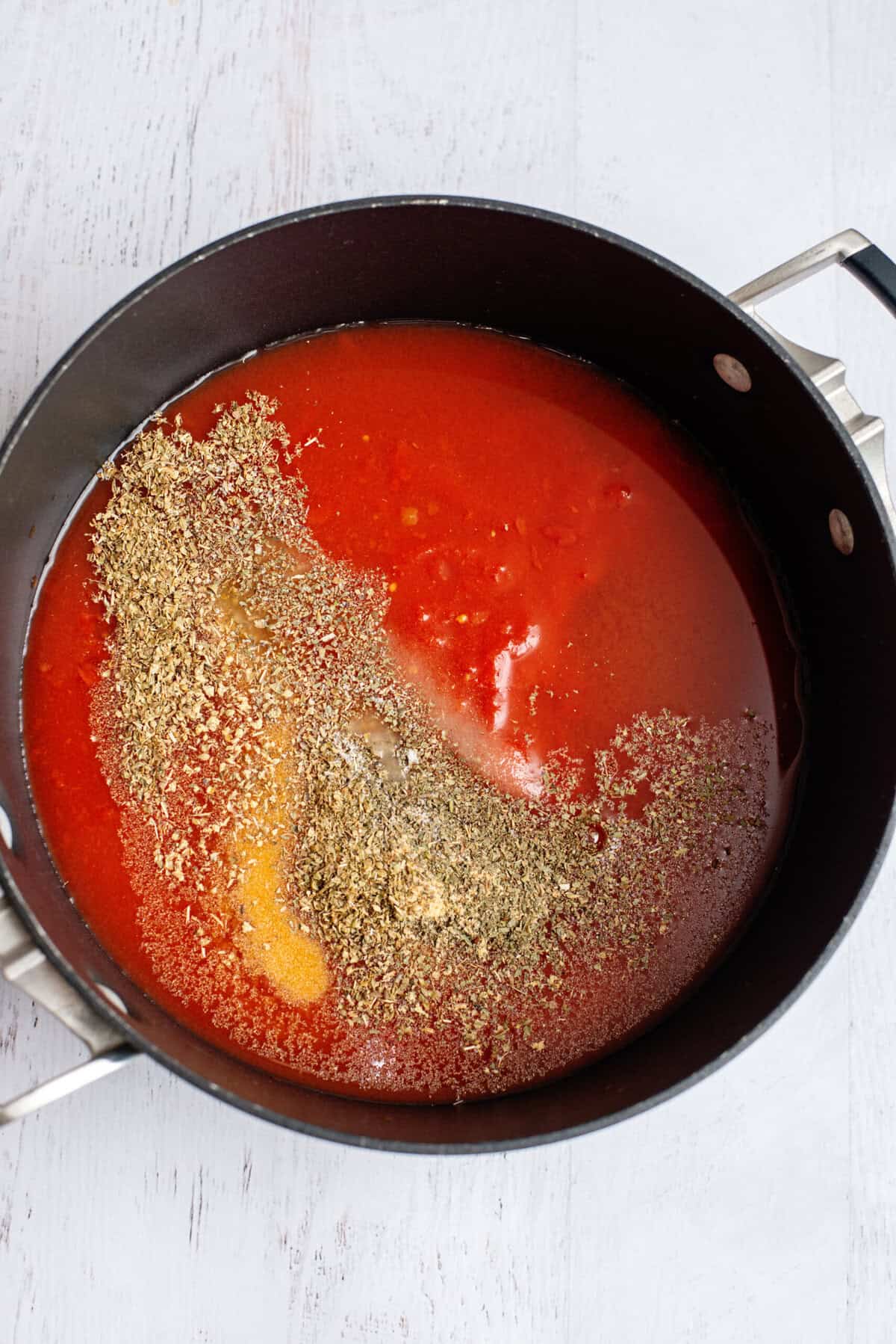 Pot with sauce and seasonings